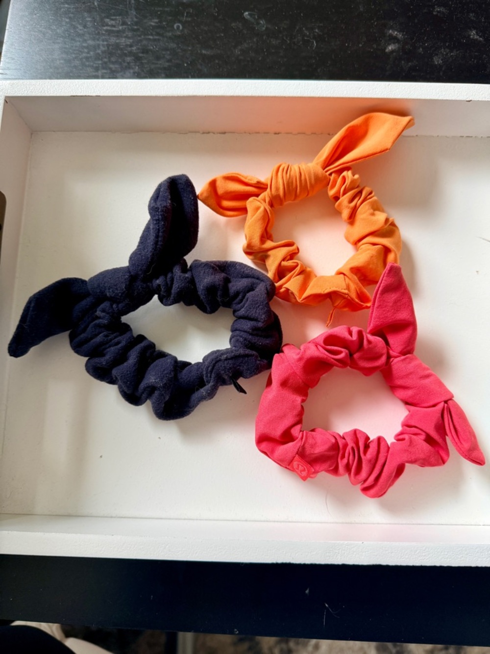 Lululemon uplifting scrunchies-bow in Brushed Black, Orange and Raspberry